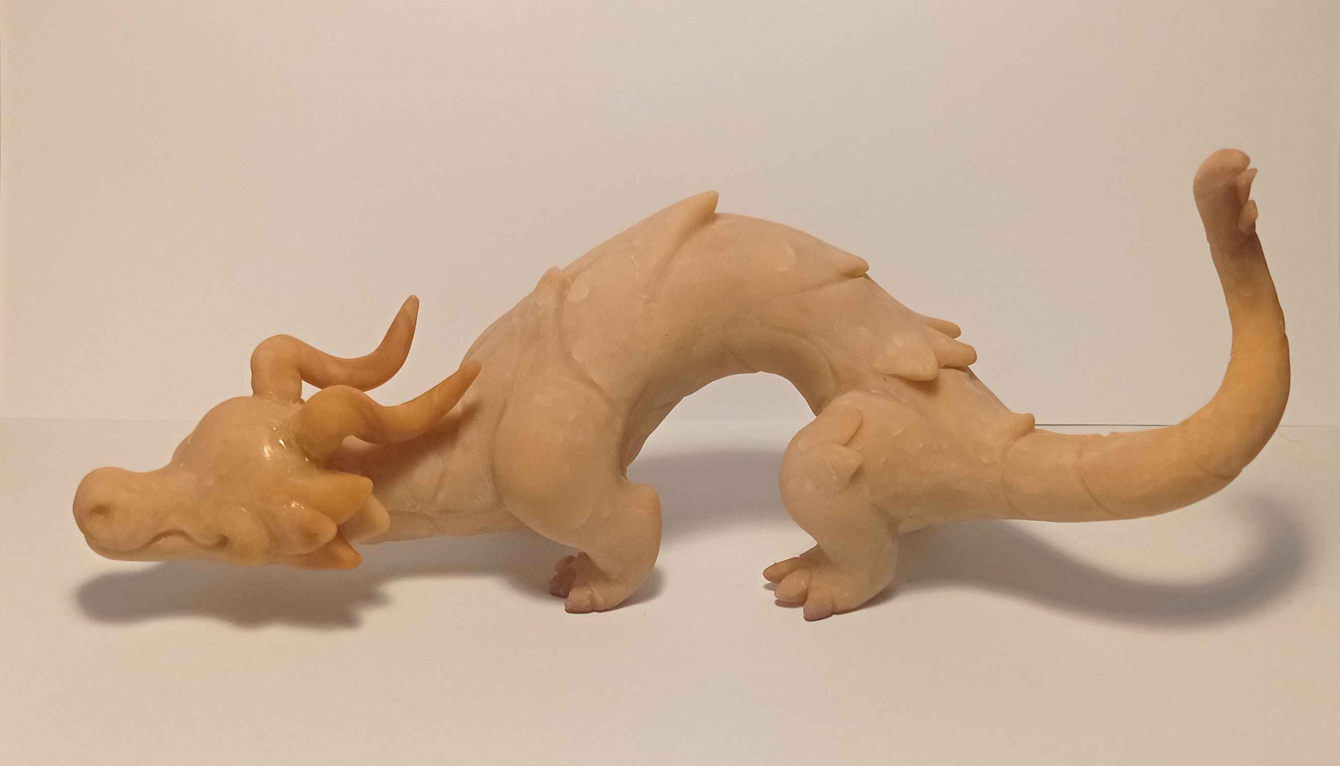 A medium sized sculpture of a blue and yellow dragon WIP2