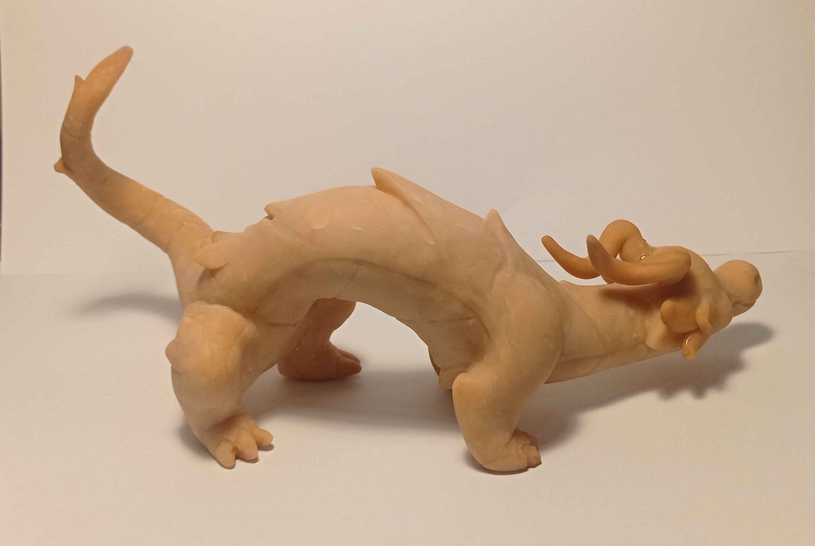 A medium sized sculpture of a blue and yellow dragon WIP1