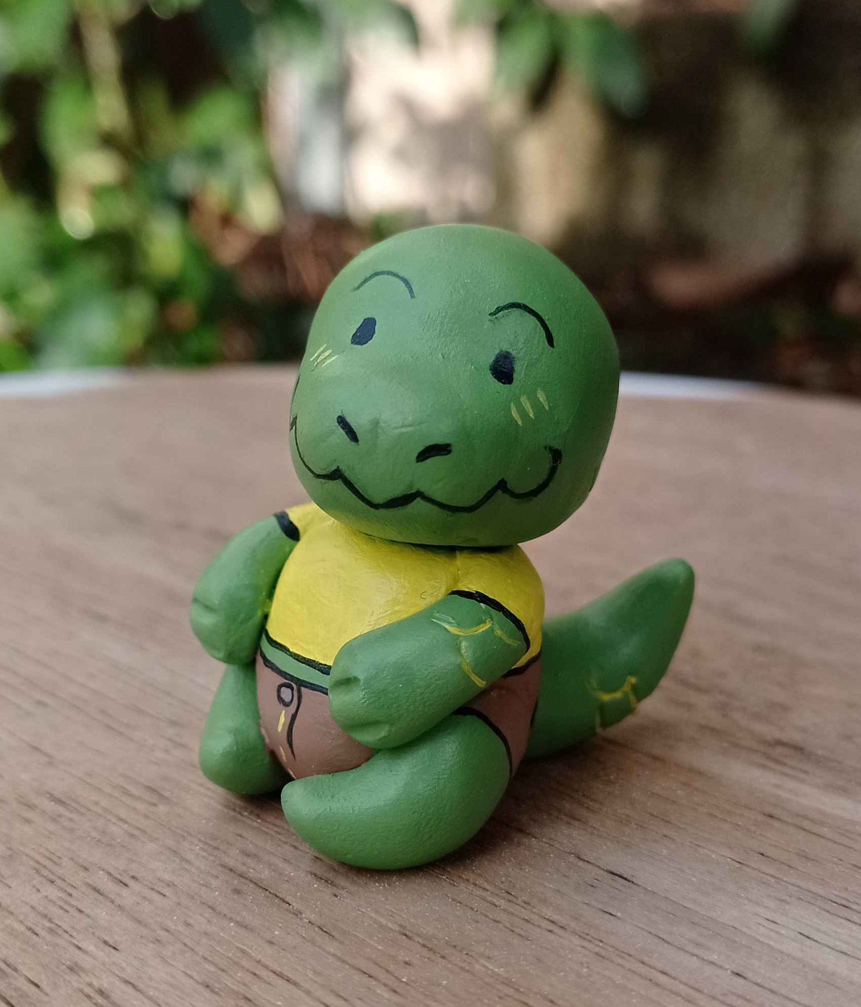 Tiny hand-made sculpture of a kobold, a green dragon